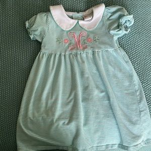 Girls monogrammed with “M” dress